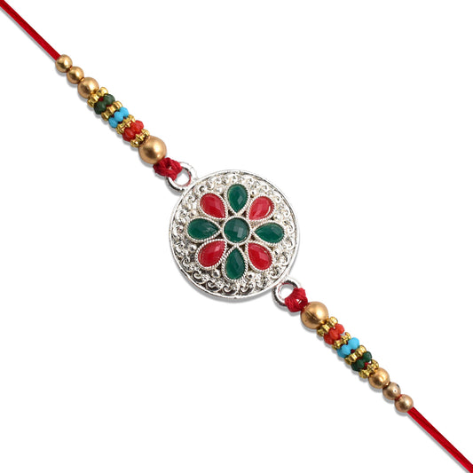 Silver Plated Floral Rakhi With Red Green Stones
